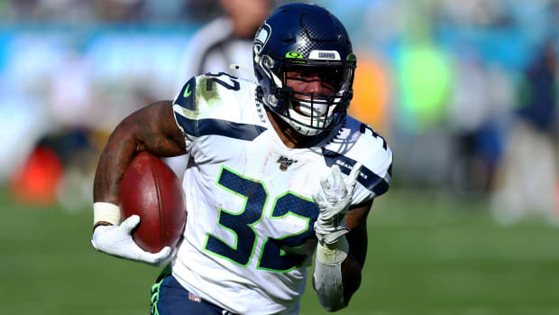 Dec 15, 2019; Charlotte, NC, USA; Seattle Seahawks running back Chris Carson (32) carries the ball during the first quarter against the Carolina Panthers at Bank of America Stadium. Mandatory Credit: Jeremy Brevard-USA TODAY Sports